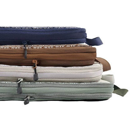 A packing cube for travel and travel organiser packing cubes neatly packed inside a suitcase.