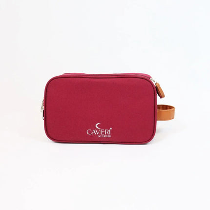 A travel accessories bag and cosmetic bag organizer packed with toiletries and makeup.