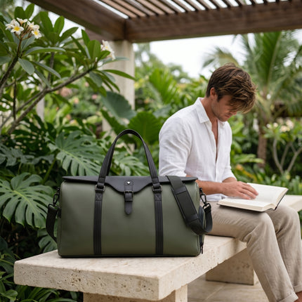 Man sitting outdoors with a green caveri marlowe duffel bag next to him. tropical holiday feel