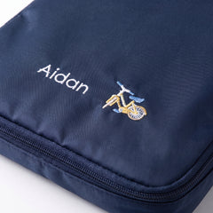 Caveri personalised packing cube in Ink Blue with embroidered bicycle icon
