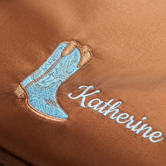 Caveri personalised packing cube in Caramel with embroidered cowgirl boot icon