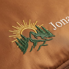 Caveri personalised packing cube in Caramel with embroidered sun and mountains icon
