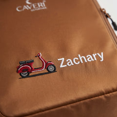 Caveri personalised packing cube in Caramel with embroidered scooter icon