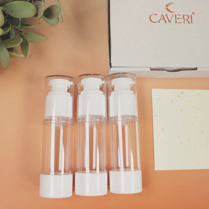 Caveri set of three 30ml clear vacuum pump travel bottles with white caps beside branded gift box