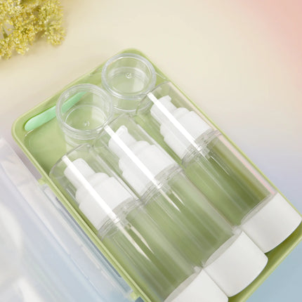 Caveri 6-piece travel bottle set in sage green with pump dispensers and cream jars, open case view