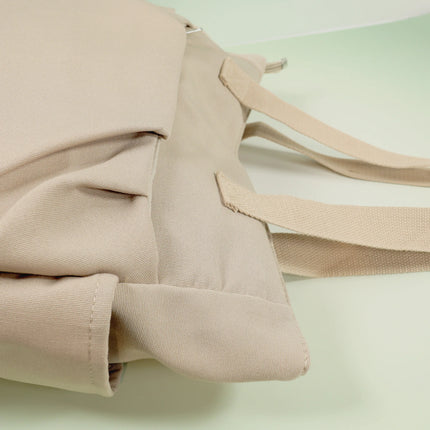 Caveri Beatrice bag in sand canvas with woven straps and side pocket detail, close-up