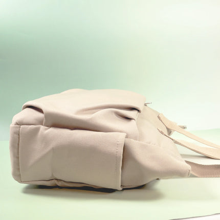 Caveri Beatrice canvas bag in sand showing base and side pocket detail with adjustable strap
