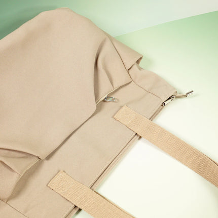 Caveri Beatrice tote bag in sand showing zip closure and woven canvas handles detail