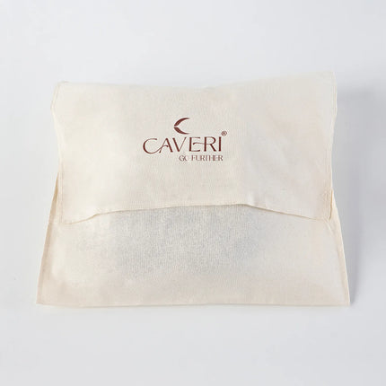 Caveri natural cotton dust bag with fold-over flap and branded logo in cream