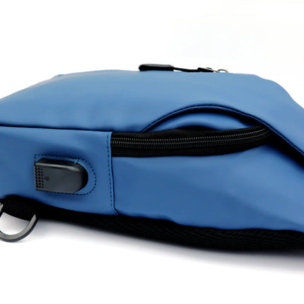 Caveri blue day bag side view showing USB charging port and zip pocket detail