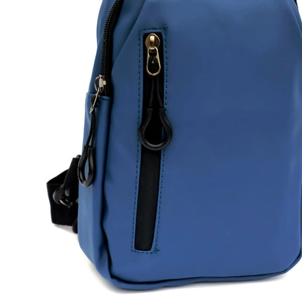 Caveri day bag in steel blue with gold zipper pull and front zip pocket, side angle view