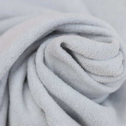 Close-up of Caveri grip wrap in light grey showing soft textured microfibre fabric detail