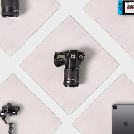 Caveri grip wrap organising travel tech gear including DSLR camera, lens, gimbal, iPad and Nintendo Switch