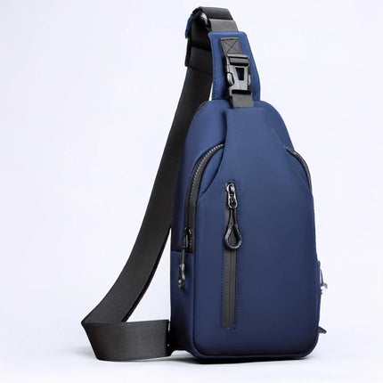 Caveri Jordan crossbody sling bag in navy blue with front zip pocket and adjustable black shoulder strap