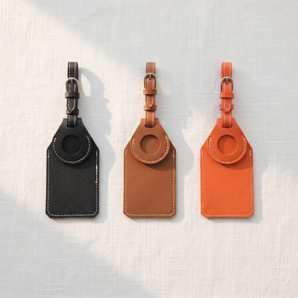Caveri AirTag luggage tags in Black, Brown and Orange