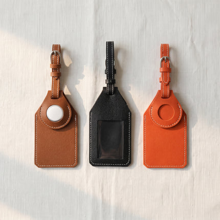Caveri luggage tags with AirTag pocket in Brown, Black and Orange