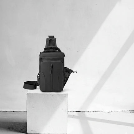 Caveri Tony 012 black sling bag with zip pockets and mesh bottle holder, front view