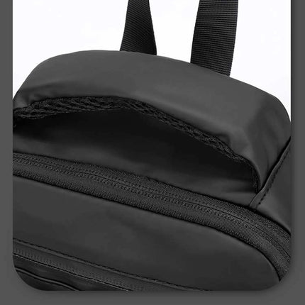 Caveri Tony crossbody sling bag in black showing zip pocket and carry handle detail