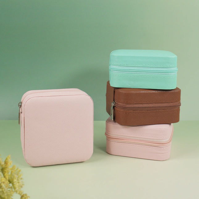 Caveri travel jewellery pouches in blush pink, chocolate brown and mint green with zip closure