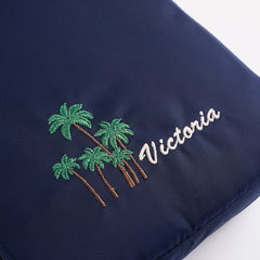 Caveri personalised packing cube in Ink Blue with embroidered palm trees icon
