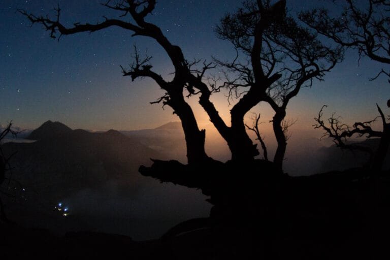 Bright blue flames glowing in the dark at Kawah Ijen’s sulphuric crater in Java, Indonesia