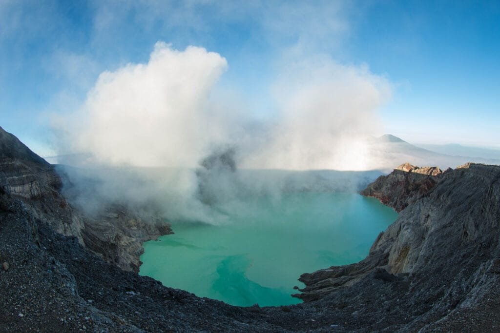 Bright blue flames glowing in the dark at Kawah Ijen’s sulphuric crater in Java, Indonesia